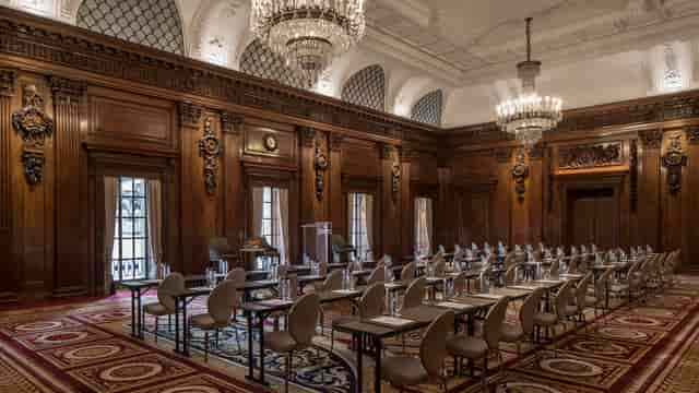United Nations Ballroom at Four Seasons London: wood-paneled room for executive meetings or seminars.