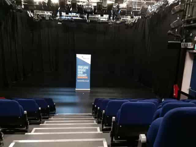 Black-box theater at Brentwood Auditorium, ideal for intimate speaker series and workshops.