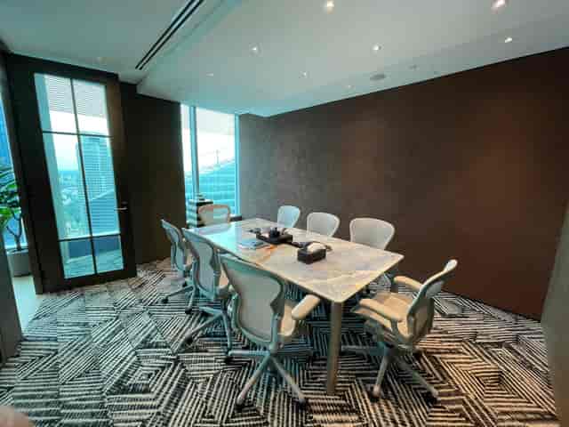 Boardroom at One Raffles Quay North Tower with ergonomic seating for executive meetings.