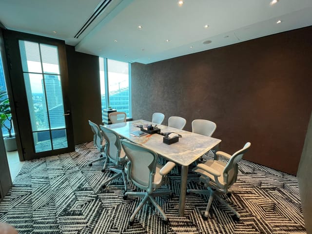 Boardroom at One Raffles Quay North Tower with ergonomic seating for executive meetings.