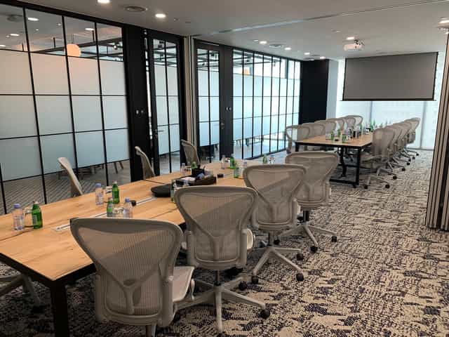 Modern boardroom at Ocean Financial Centre with wood tables for executive corporate meetings.