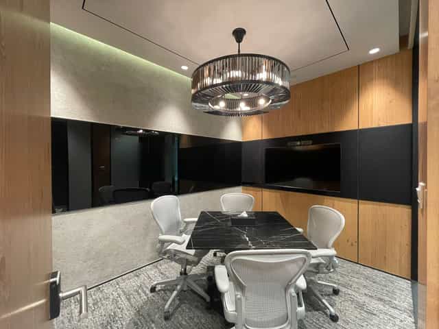 Modern huddle room at Ocean Financial Centre for executive meetings and corporate consultations.