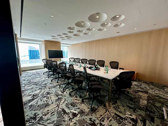 Modern executive boardroom in Singapore Land Tower for private negotiations and strategy sessions.