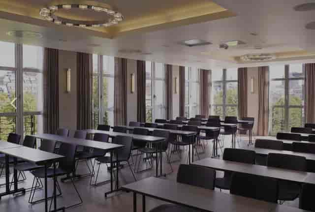 Modern conference room in Studenterlunden with classroom seating for professional workshops.
