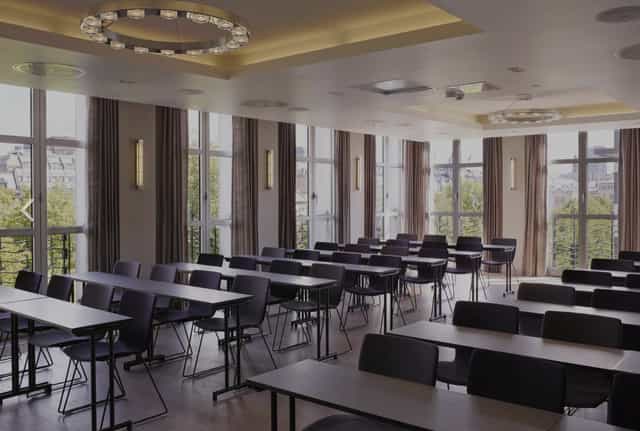 Modern conference room in Studenterlunden with classroom seating for professional workshops.