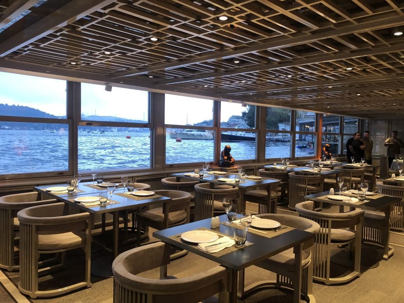 Bebek Hotel bar with scenic waterfront views, ideal for corporate dinners and networking events.