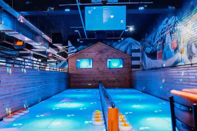Alpine-themed curling lanes at The Lodge, Liverpool, ideal for corporate team building events.