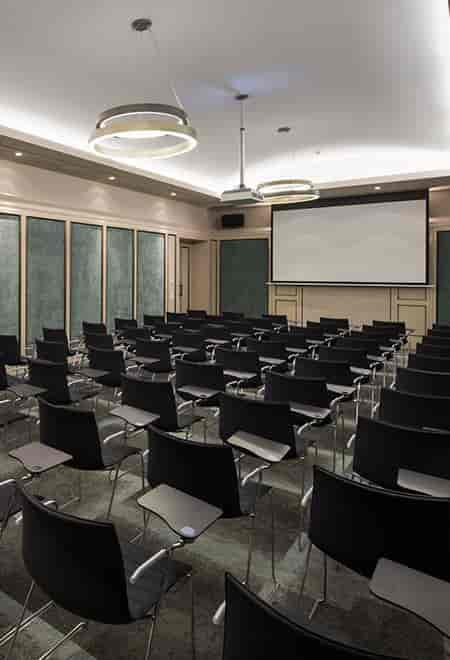 Balikli Meeting Room at 10 Karaköy: Boardroom setup with projector for professional workshops.