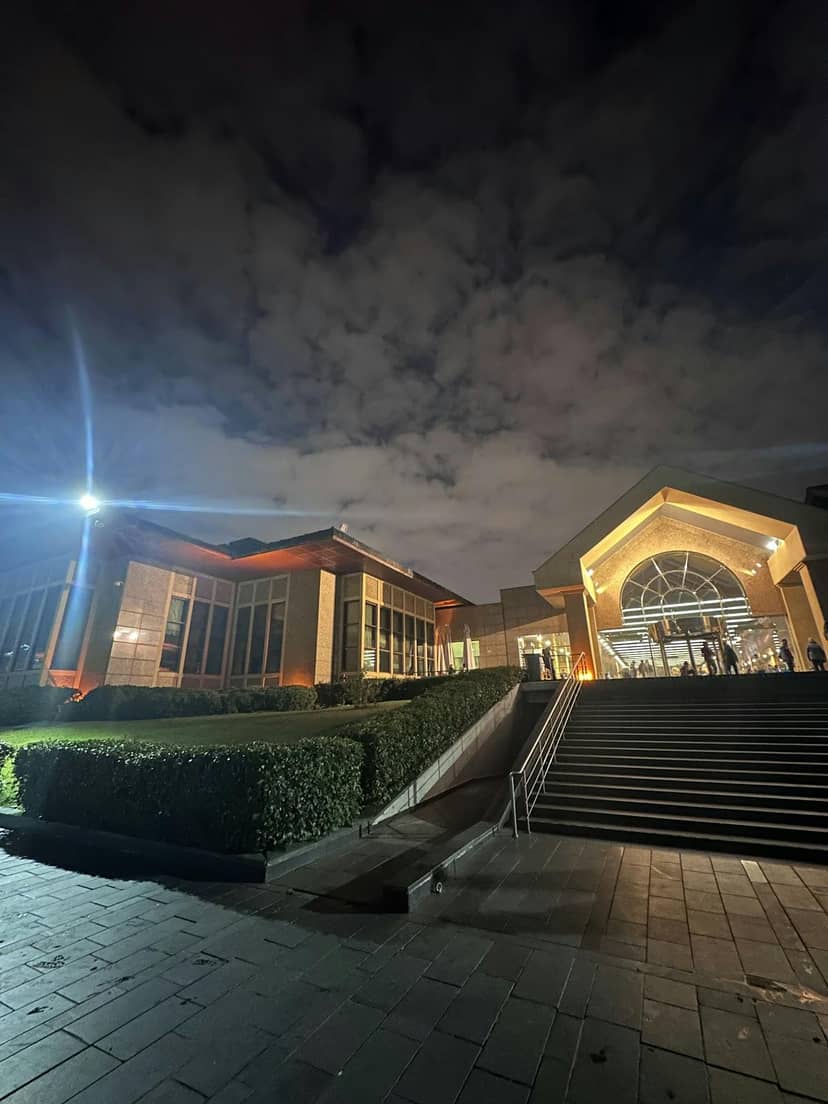 Sadabad Auditorium: Grand exterior steps and lighting for corporate events and gala conferences.