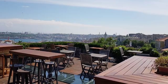 Terrace Bar Istanbul: High-top seating with panoramic city views for corporate networking events.