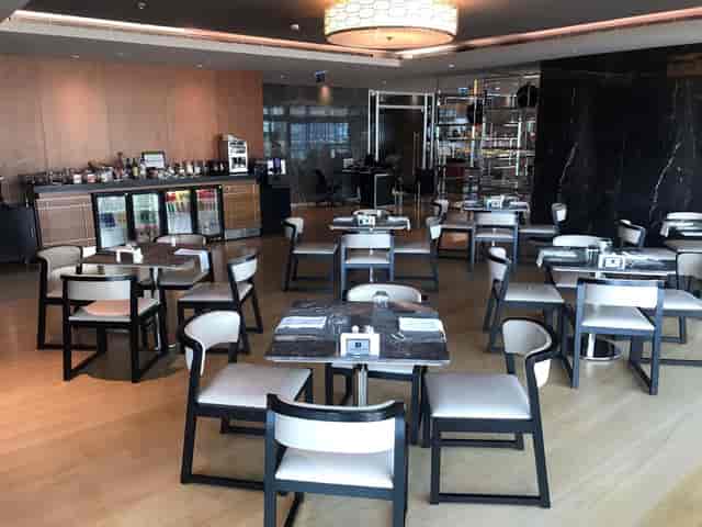 Executive Lounge with dining setup at Wyndham Grand Istanbul for corporate events and networking.