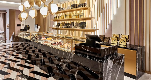 Vakko L'Atelier black marble catering station for luxury brand activation and premium events.