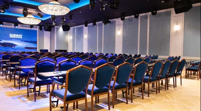 Maud Salen at Hotel Bristol: elegant blue chairs for corporate event networking.