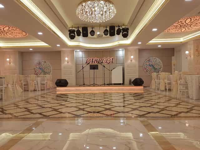 Teras Labella banquet hall with stage, ideal for corporate awards dinner and gala events.