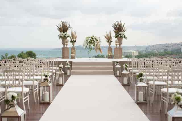Luxury Conrad banquet hall ceremony with floral decor for weddings and corporate events.