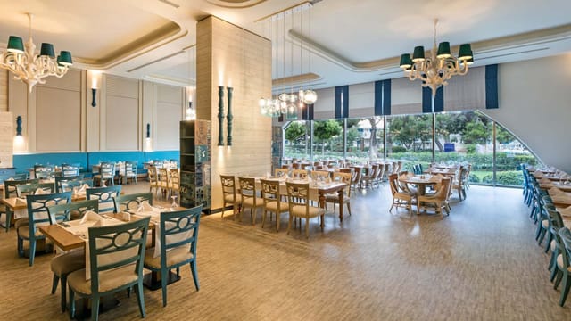 Pacific Main Saloon event space with teal accents for corporate lunches and social mixers.