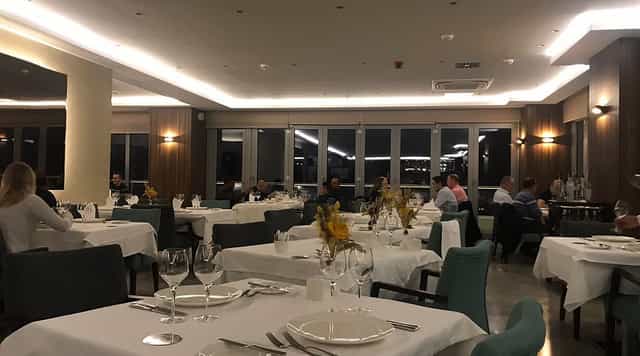 Lagun Roof Bar banquet setup: professional white-linen dining tables for corporate events.