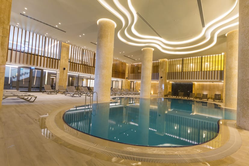 Upscale indoor pool at Radisson Hotel Istanbul Harbiye for wellness events and networking.