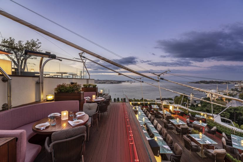 Rooftop bar at ALL Accor Live Limitless, tiered lounge for corporate events and evening receptions.