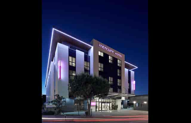 Mercure Istanbul Altunizade modern hotel exterior at dusk for corporate meetings and conferences.