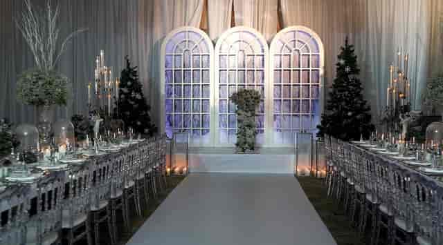 Winter gala event setup at Istanbul Marriott Hotel Sisli ballroom with arched window backdrops.