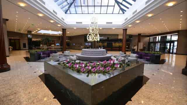 Elegant dinner theater in Grand Cevahir Hotel atrium for luxury corporate events and conferences.