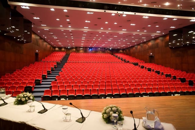 Grand Cevahir Hotel auditorium with tiered seating for keynote conferences and plenary sessions.