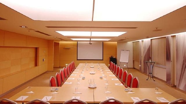 U-shape boardroom at Divan featuring AV tech, ideal for corporate meetings and business conferences.