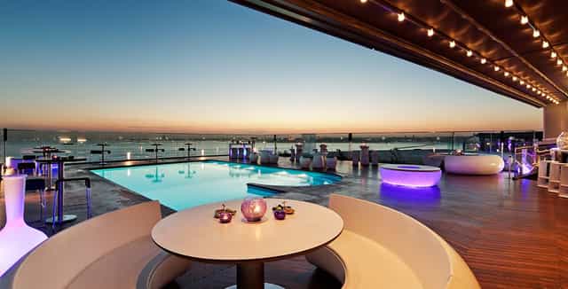 Rooftop networking reception at DoubleTree Istanbul with infinity pool and lounge seating.