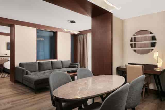 Sheraton Istanbul City Center junior suite with breakout area for VIP meetings and conferences.