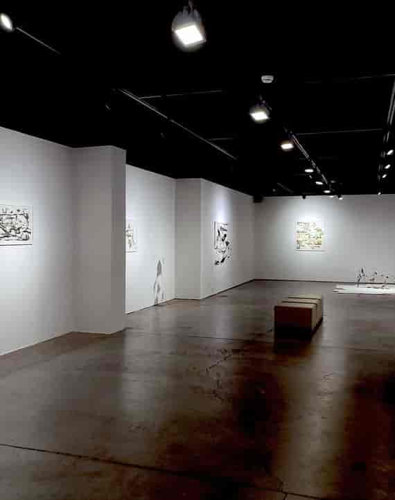Minimalist gallery space with concrete floors for product launches and VIP networking events.