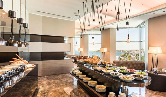 Executive Lounge meeting room with buffet at The Stay Bosphorus for upscale corporate events.