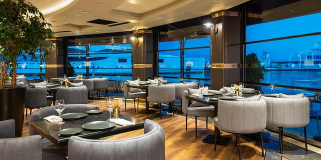 Chaka Bey waterfront dining venue with floor-to-ceiling windows for corporate dinners or receptions.