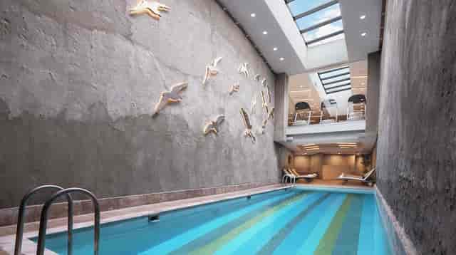 Indoor pool and fitness center at DoubleTree Hilton Istanbul Gayrettepe for business events.