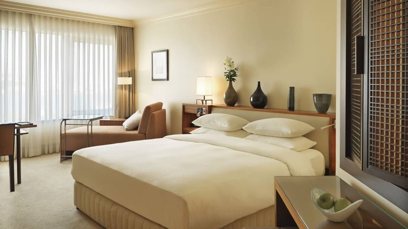 Upscale Grand Hyatt Istanbul suite with ergonomic chaise lounge for business travel and events.