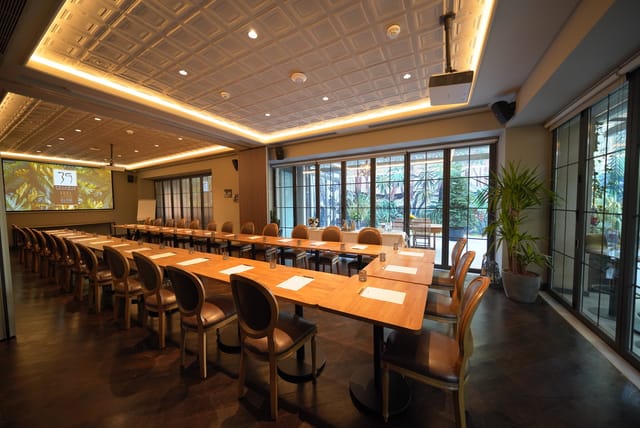 U-shape meeting room with hardwood floors for professional corporate events and board meetings.