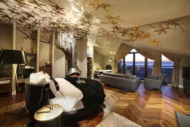 Luxury boutique hotel suite with mural and fireplace for VIP events and incentive travel.
