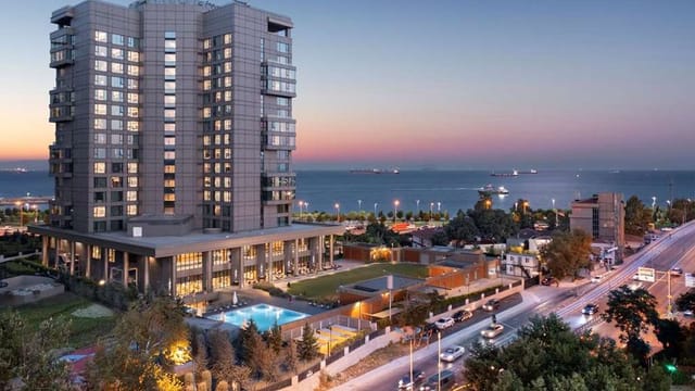 Hilton Istanbul Bakirkoy banquet hall with waterfront lawn for corporate events and receptions.