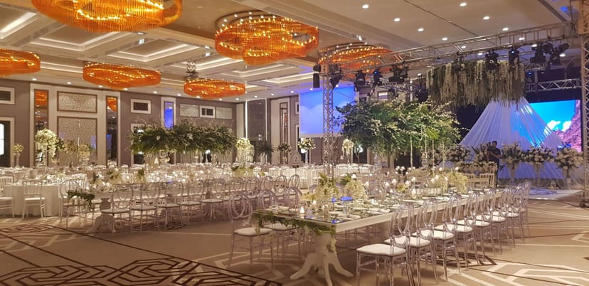 Elegant Hilton Istanbul Bakirkoy ballroom with amber lighting for gala dinner and luxury events.