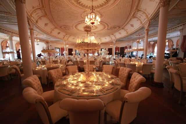 Elegant tufted seating at Adile Sultan Palace ballroom for a gala dinner or formal reception.