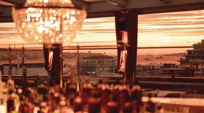 Upscale waterfront restaurant at night, perfect for an elegant evening reception or networking event.