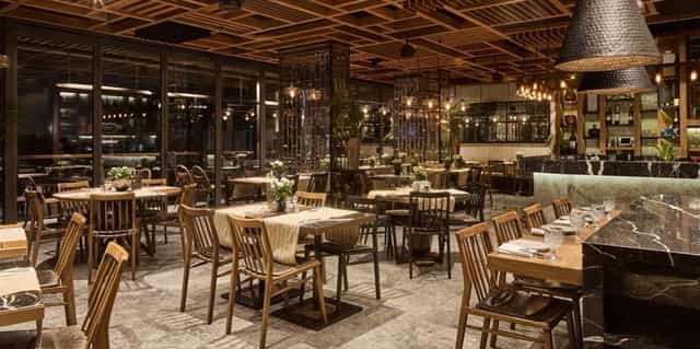 Sophisticated corporate dinner venue with wood-paneled ceiling at Gezi Hotel Bosphorus.