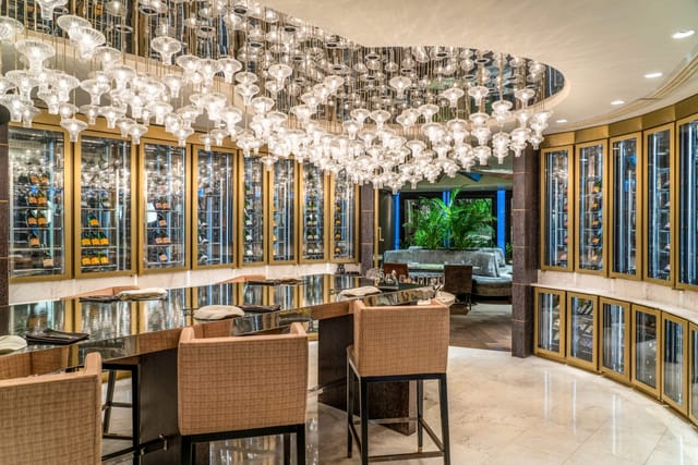 Private dining room at Raffles Istanbul featuring luxury wine storage for executive board dinners.