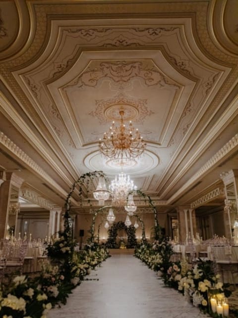 Luxury ballroom venue with crystal chandeliers for weddings and corporate gala events.