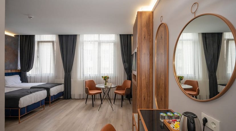 Seyithan Palace Hotel twin room with seating area for small business meetings and event blocks.