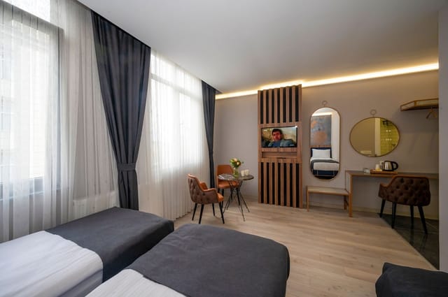 Modern twin hotel room at Seyithan Palace, ideal for business meetings and corporate event blocks.