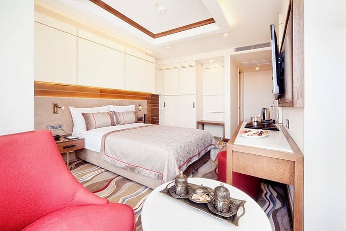 Modern Grand Hotel de Pera suite with dedicated workspace for corporate business travel.