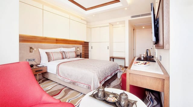 Grand Hotel de Pera suite with desk space, ideal for business travel and conference lodging.