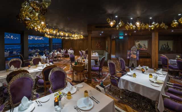 Private dining room at 34 Restaurant with purple velvet seating for executive dinners and events.
