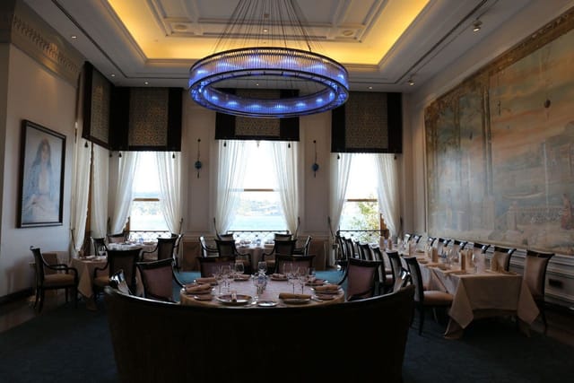 Tugra Restaurant private dining with crystal chandelier for corporate dinners and VIP luncheons.